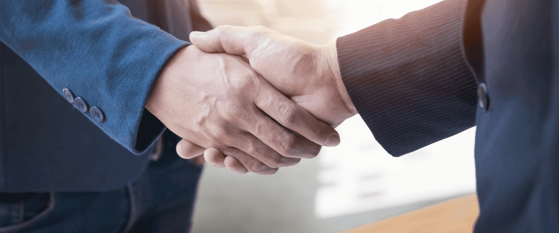 two-confident-business-man-shaking-hands-meeting-office-success-dealing-greeting-partner-concept 2.png